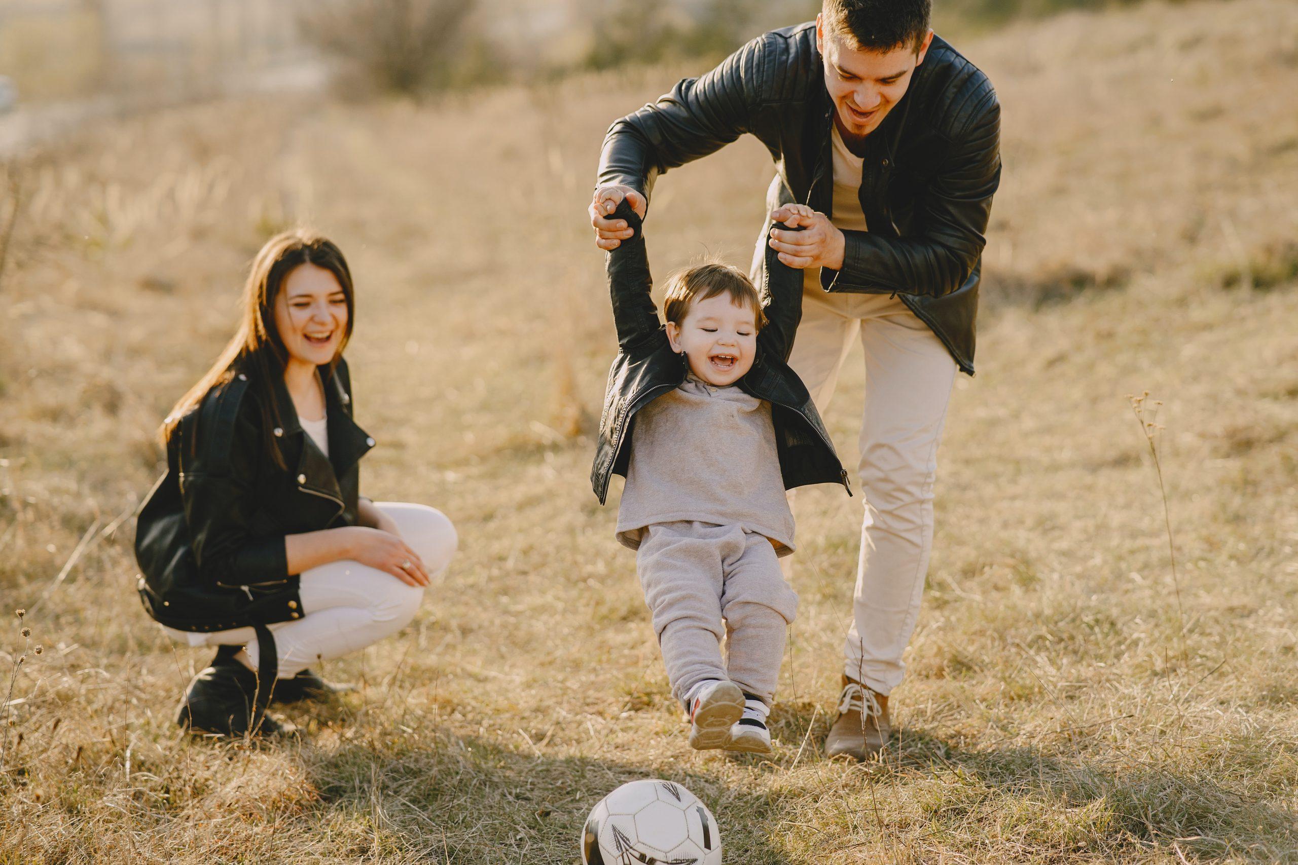 Photo of Family Having Fun With football