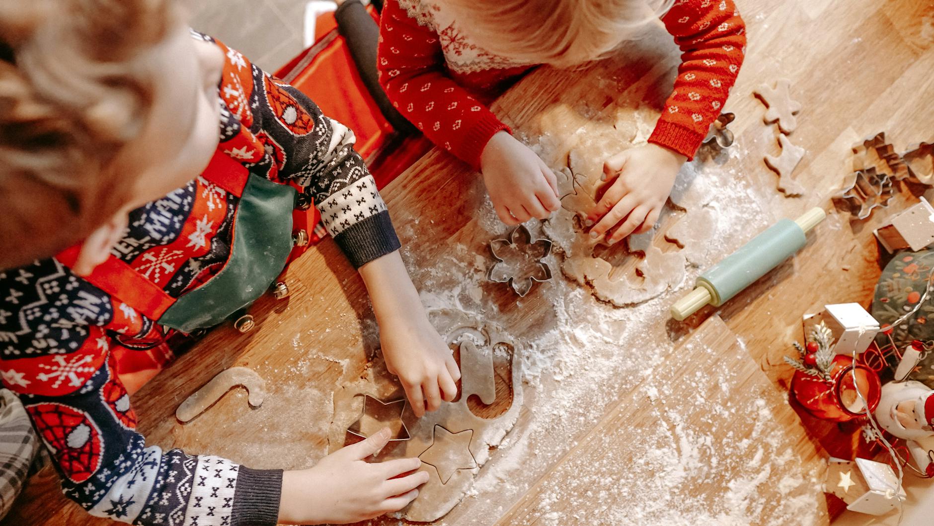 kids cutting christmas cookies