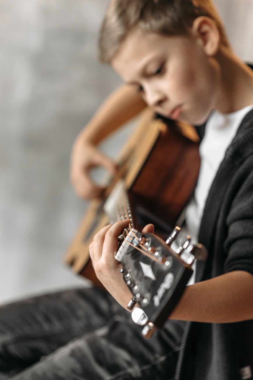 boy playing guitar