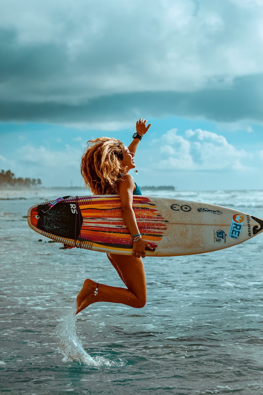 a woman with a surfboard