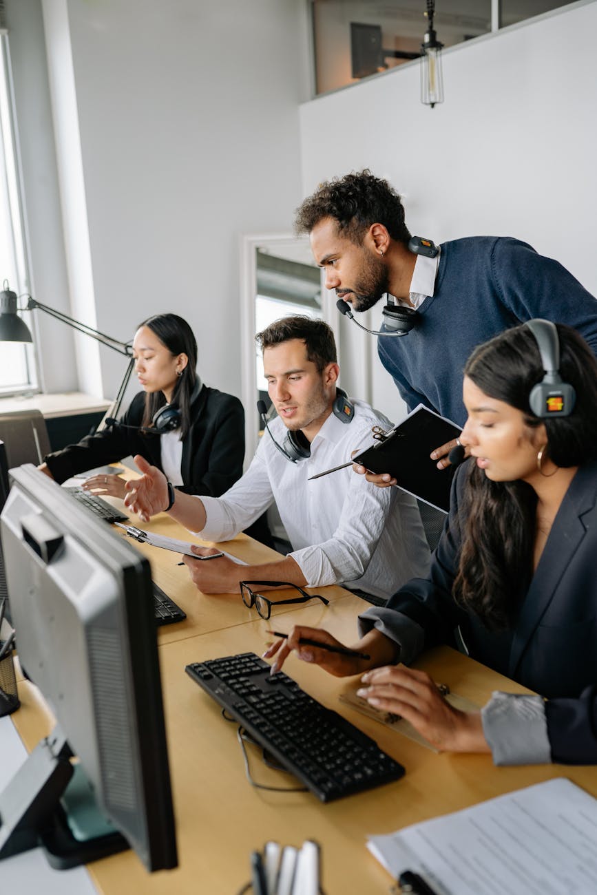 four people working in the office