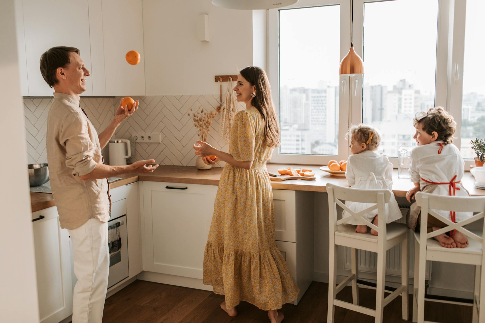 a family having breakfast in the kitchen area