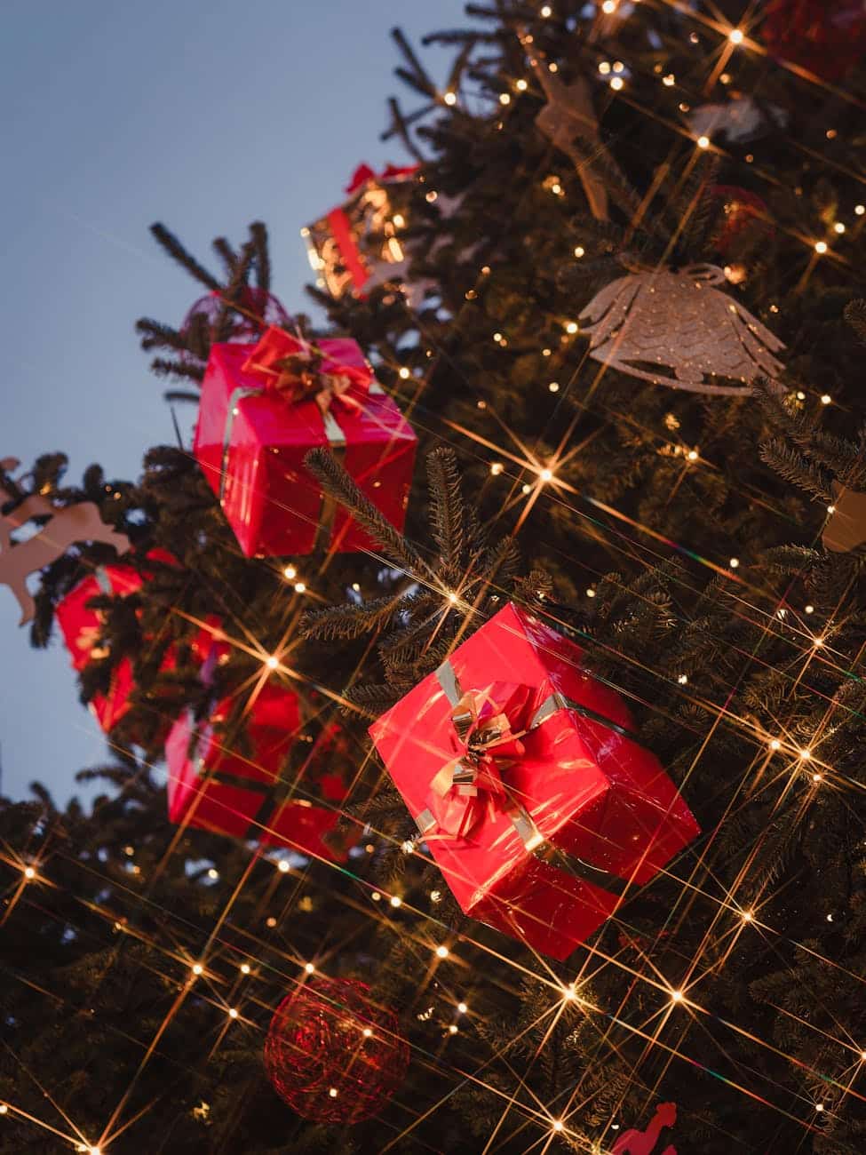 festive christmas tree with red gift decor