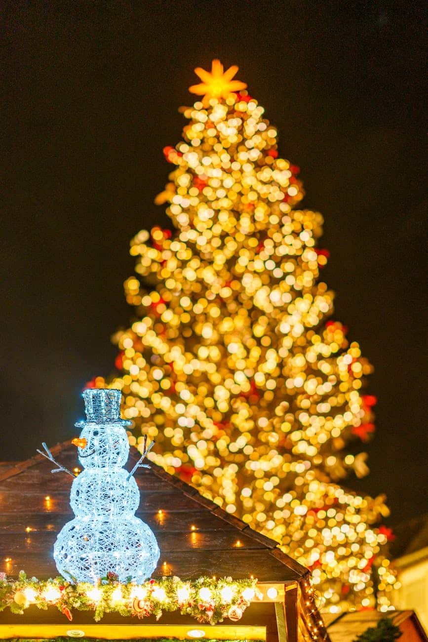 festive christmas tree with illuminated snowman
