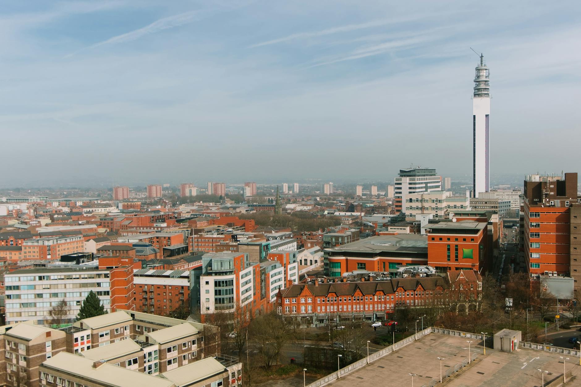 cityscape with residential buildings and tower