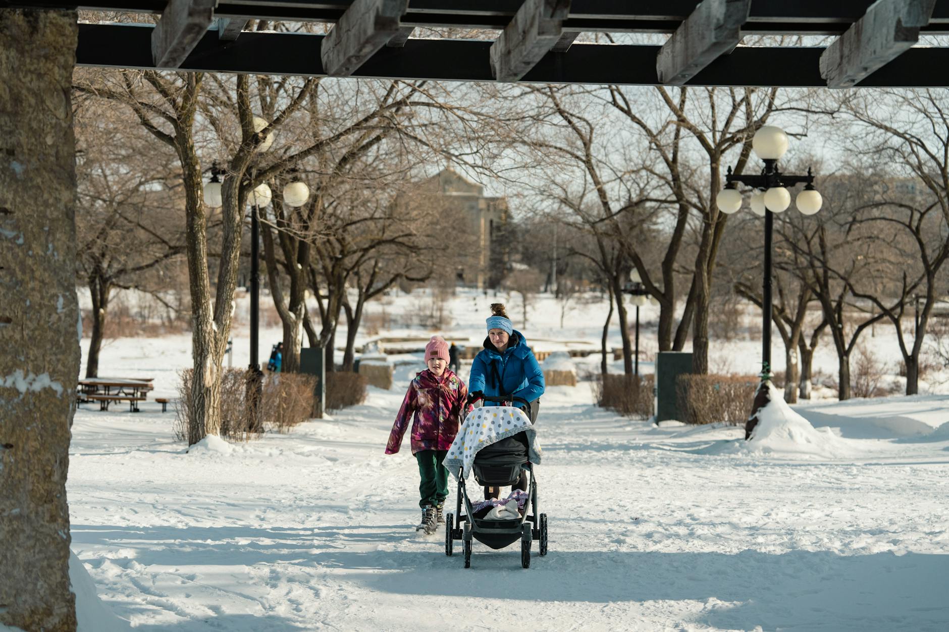 winter family stroll in snowy park