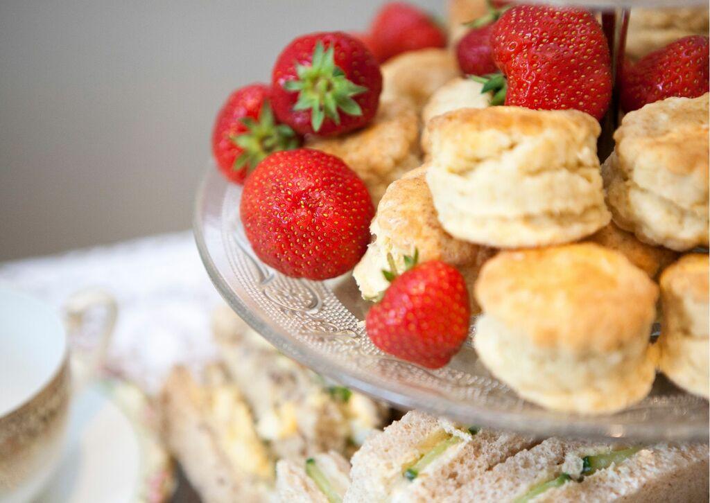 Scones with strawberries and sandwiches.