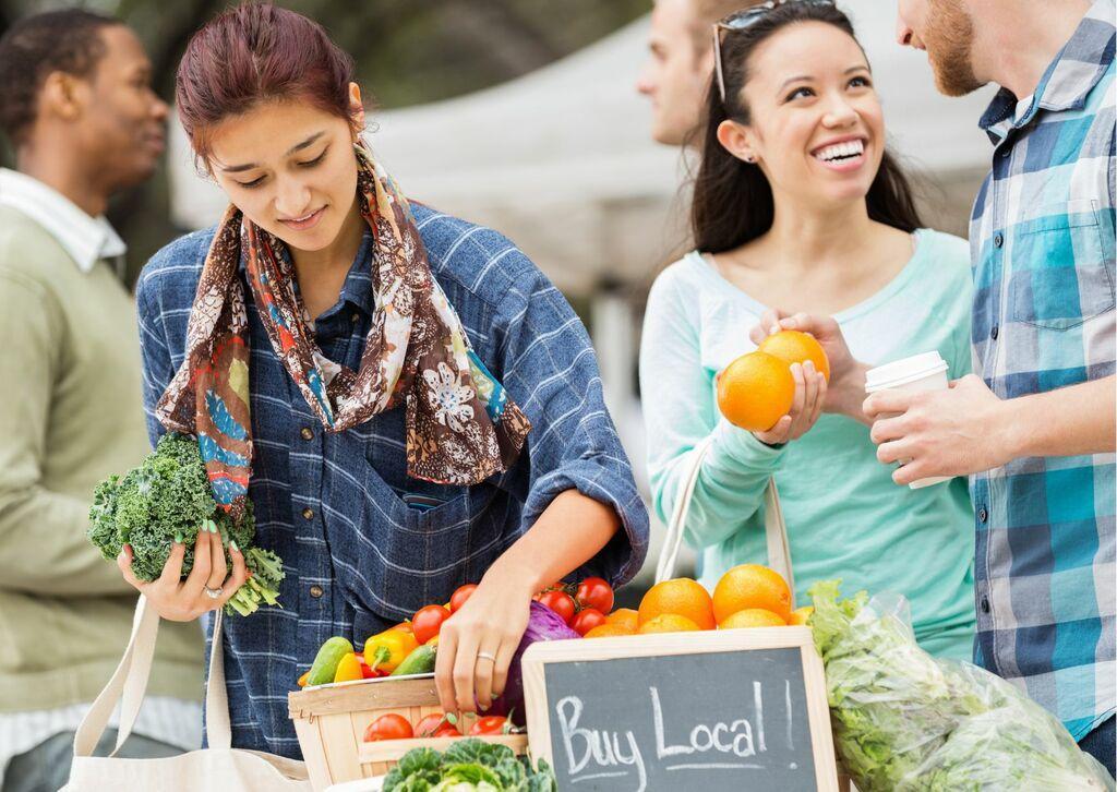 Couple shopping at local farmers market.