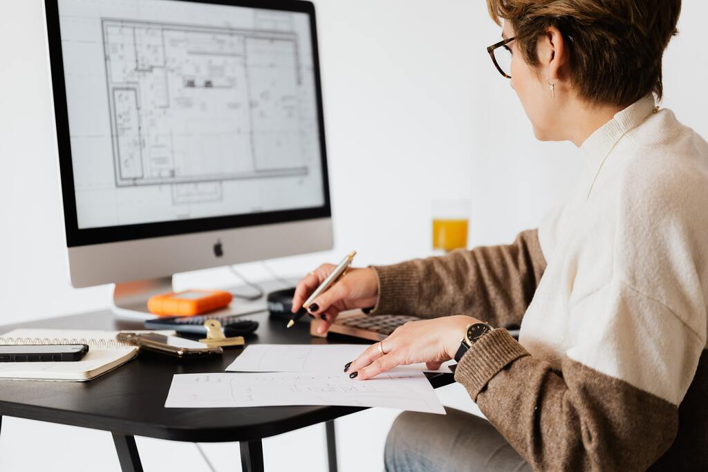A person working and drawing.
