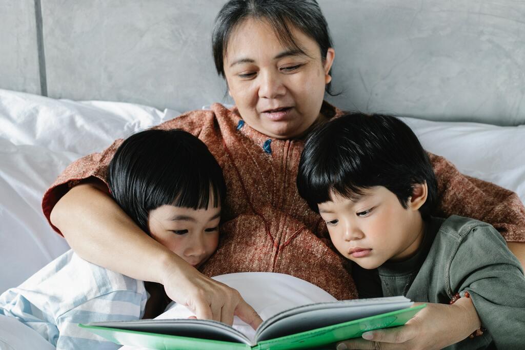 A mother reading a story to her children