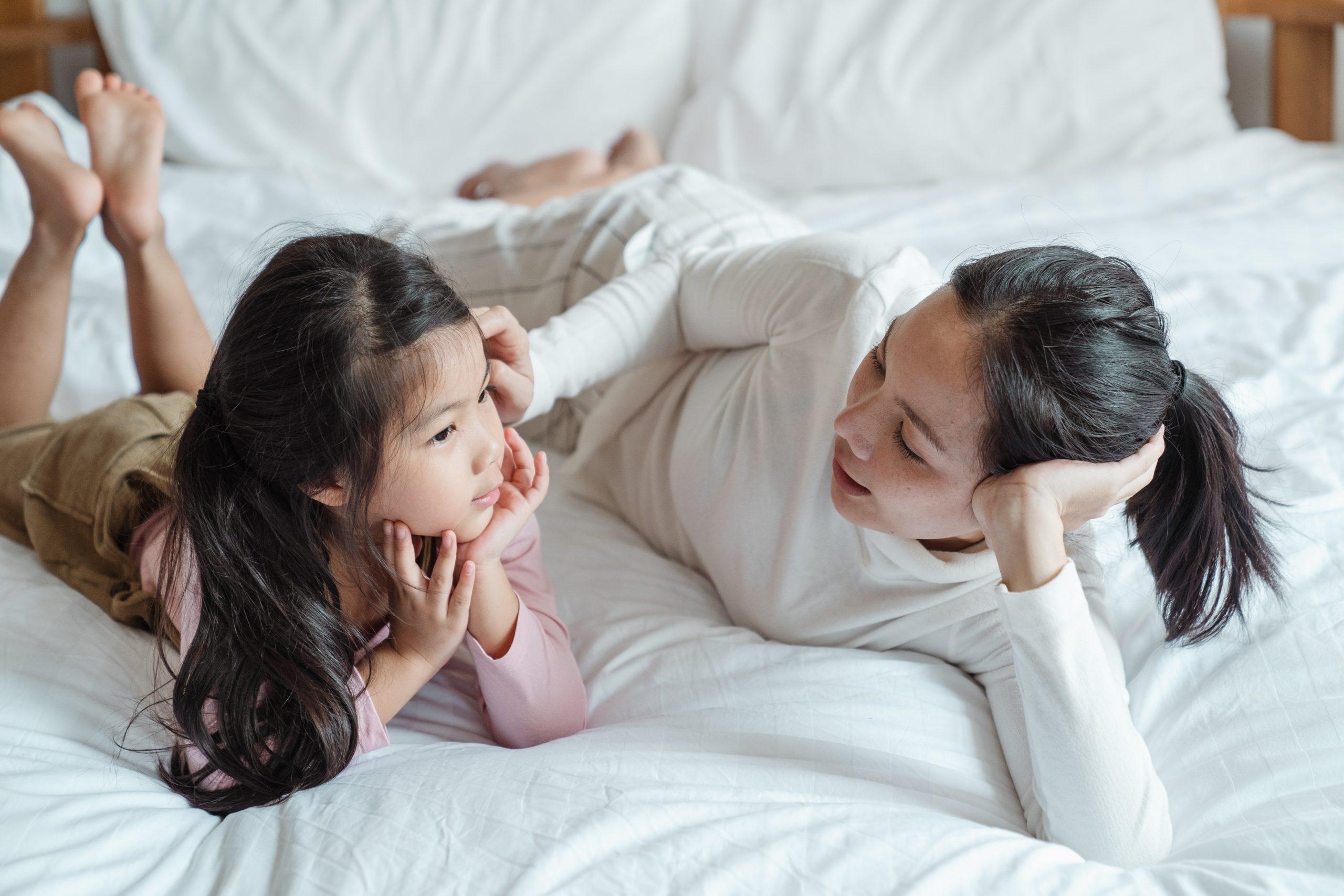 A mom and her daughter are talking.