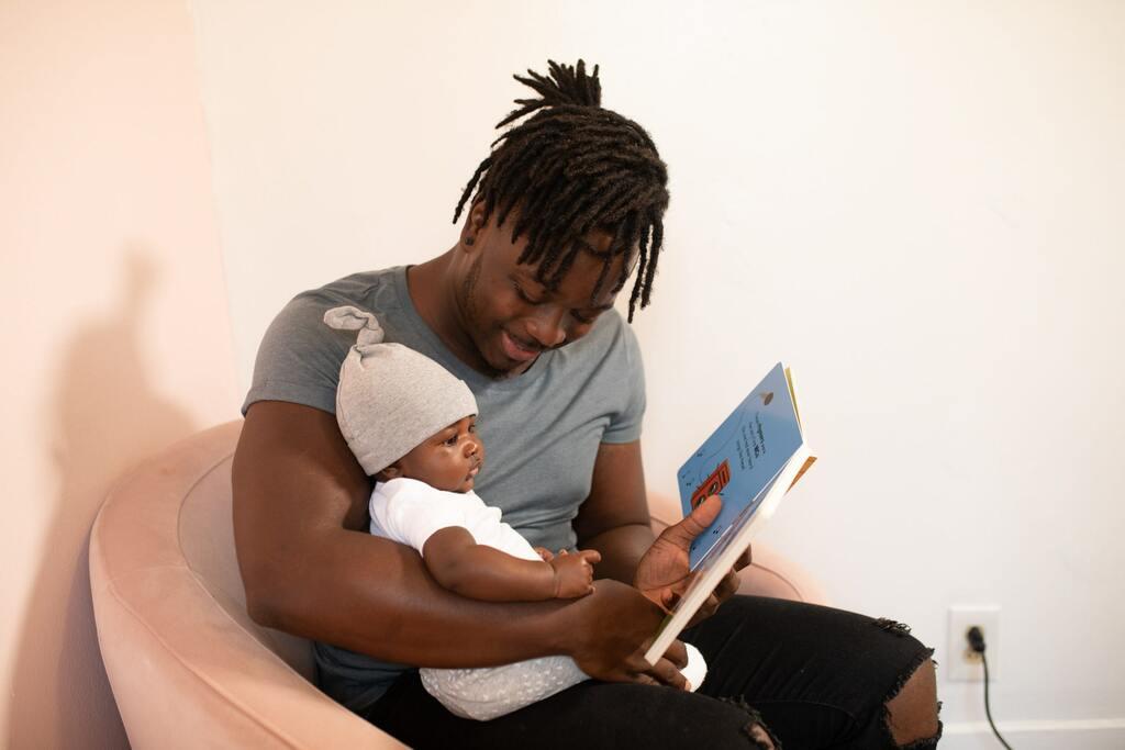 A dad reading to his daughter and embracing presence in a busy world.