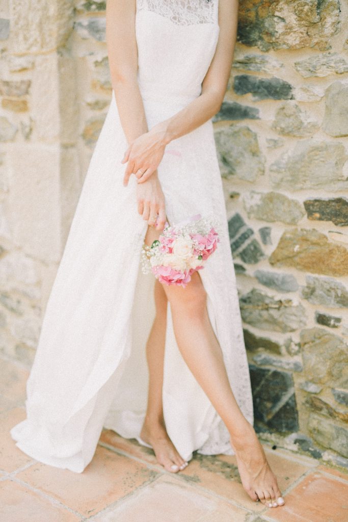Bride Standing While Holding Bridal Bouquet