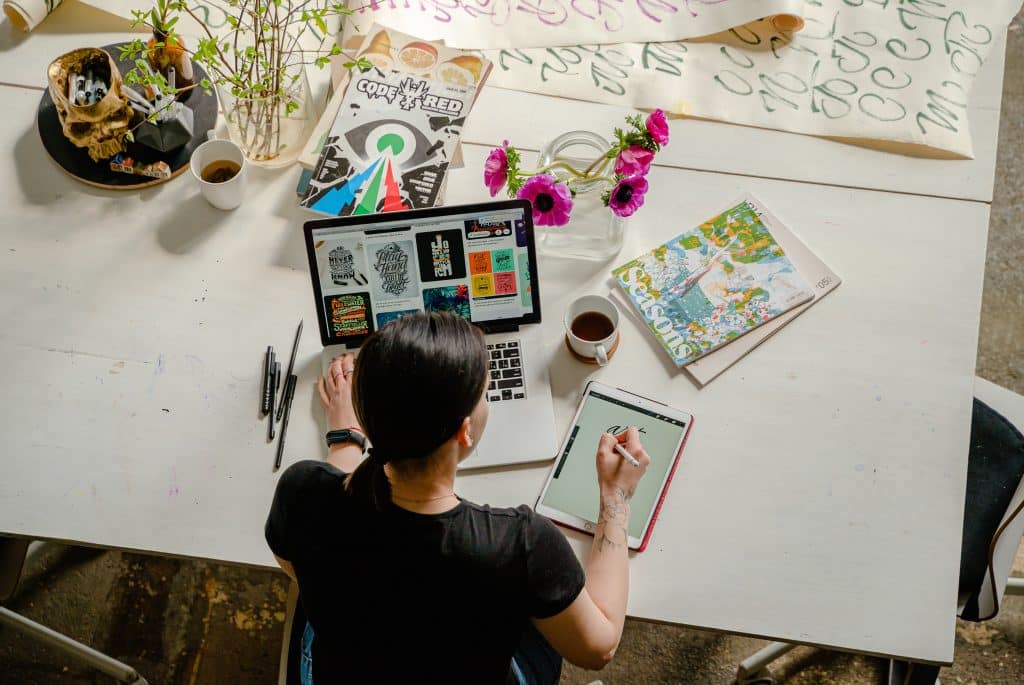 Woman working on ipad while searching internet.