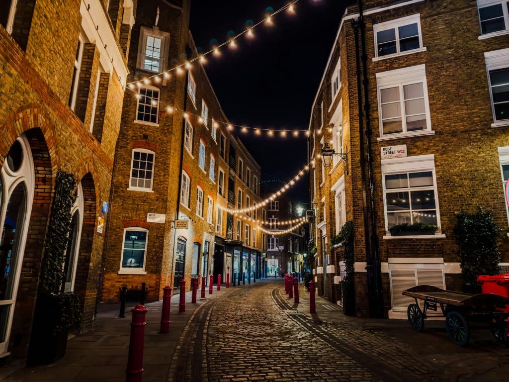 String Lights above the Cobblestone Street in Soho, London, England