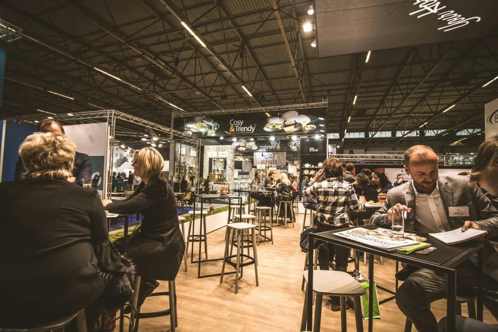 People Inside a Cafe With Tables and Chairs networking