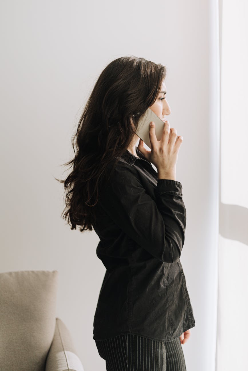 professional woman on phone in bright office
