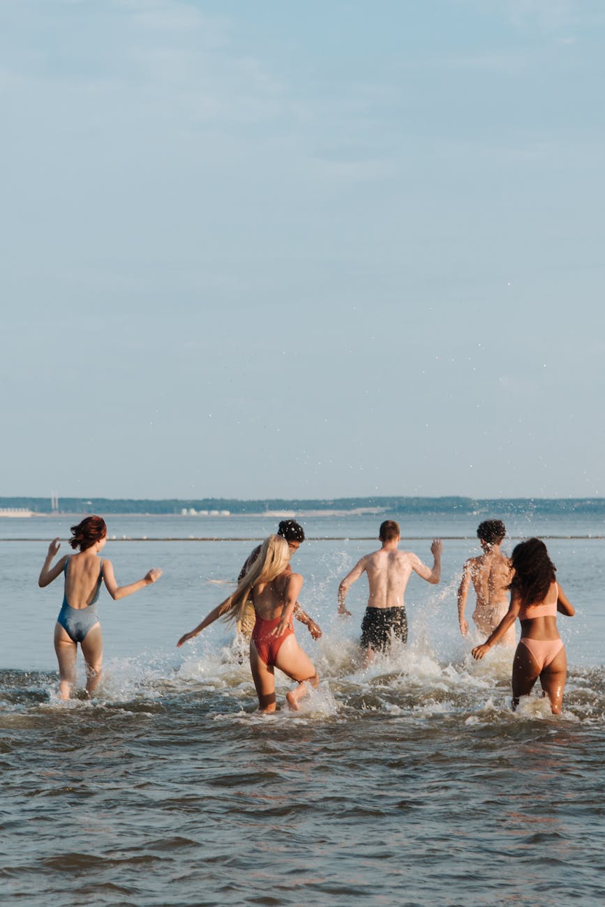 teenagers on vacation playing in water