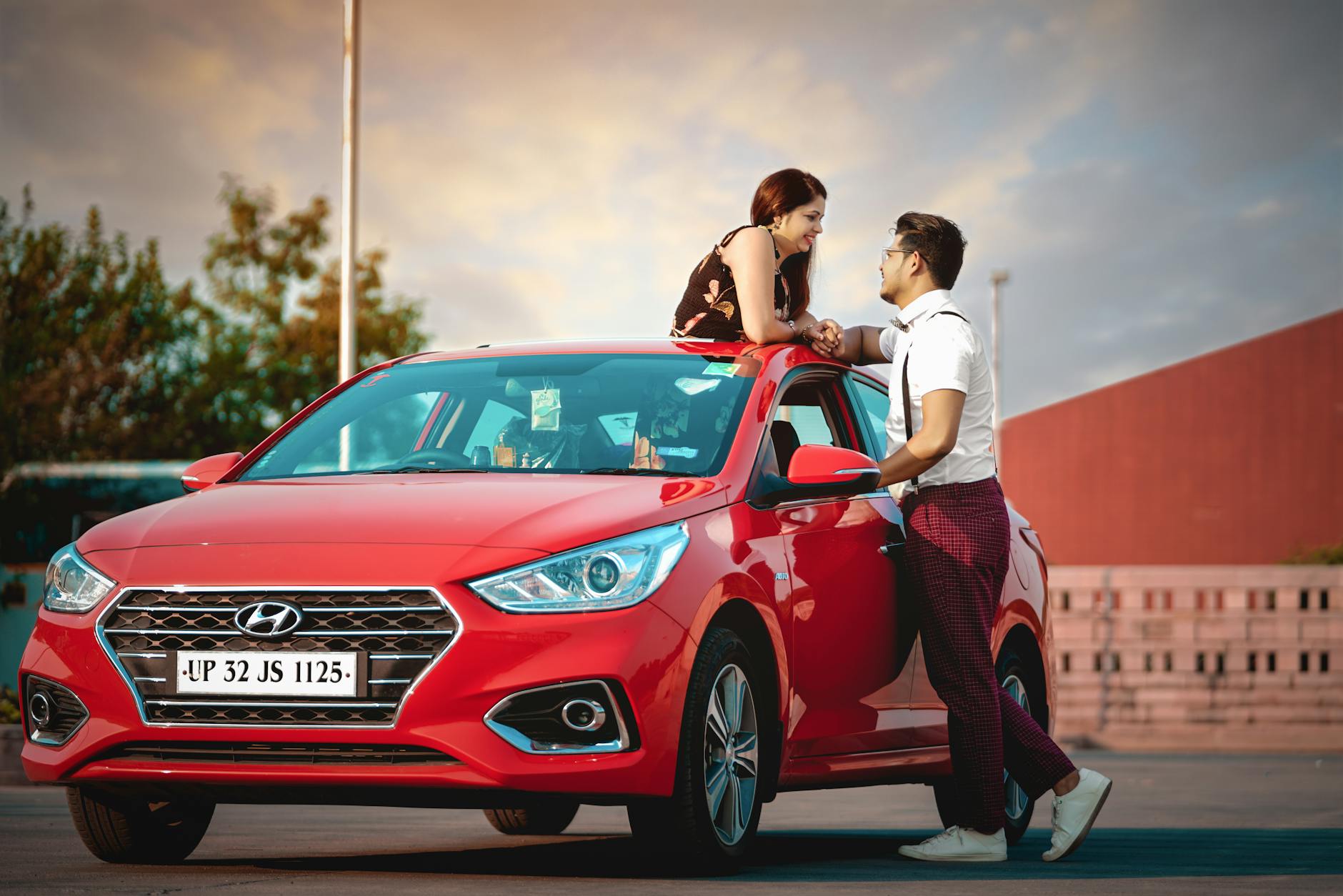 man and woman on a car