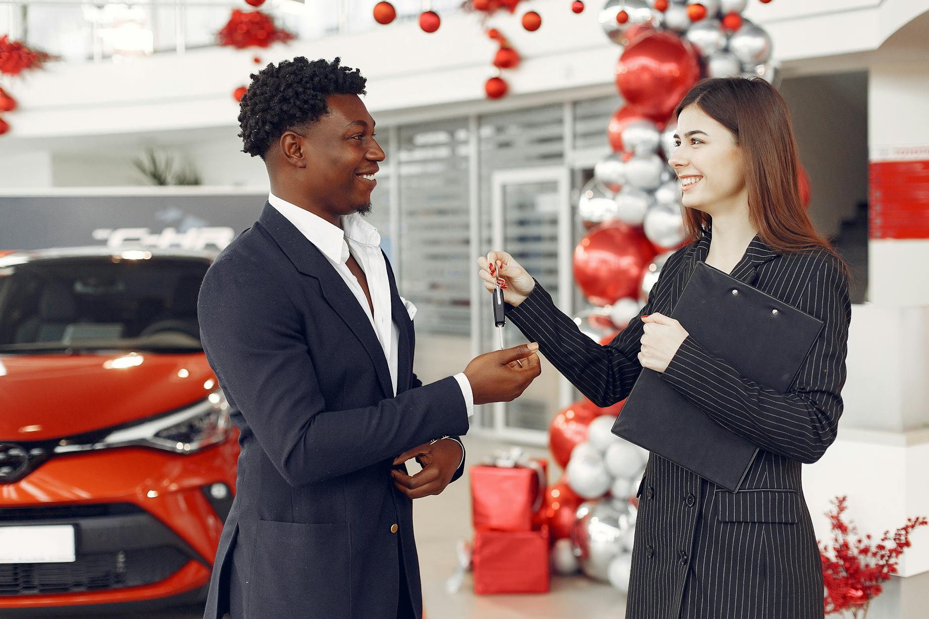 car dealer handing over the carkeys