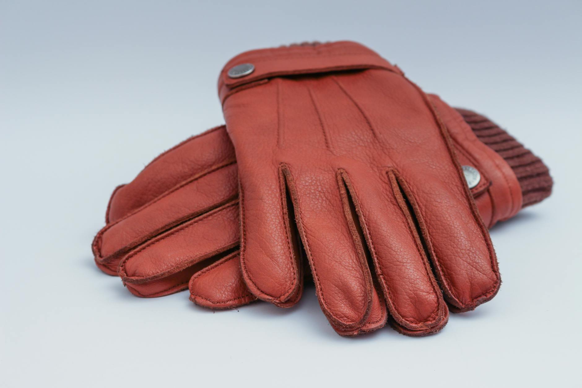 pair of brown leather gloves illustration