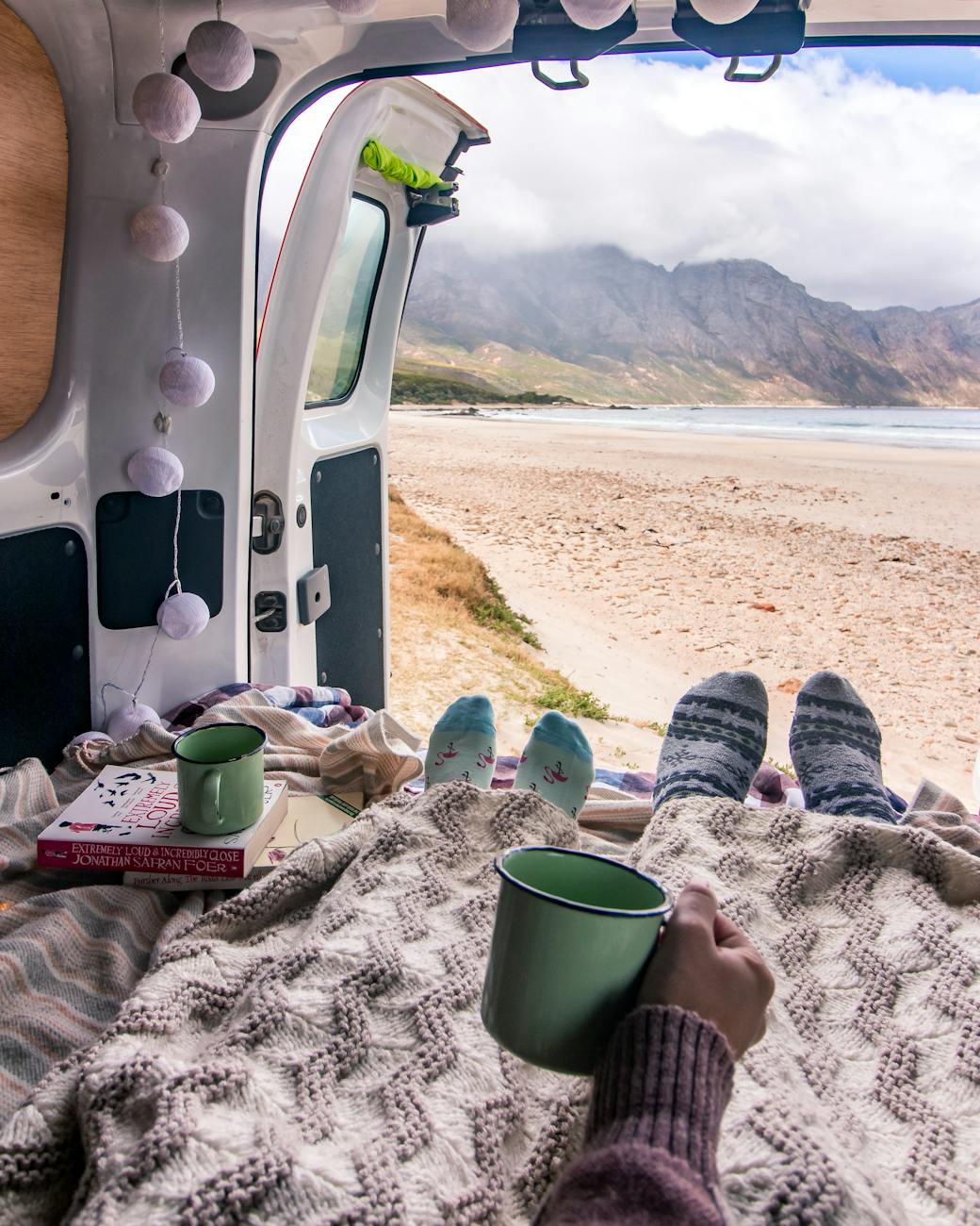 a couple sitting in the campervan