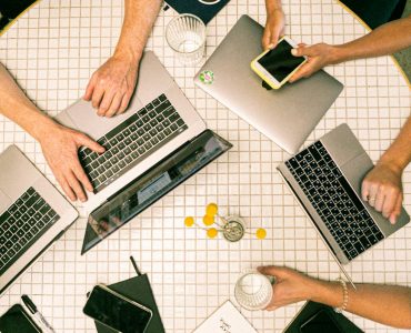 photo of people using laptop