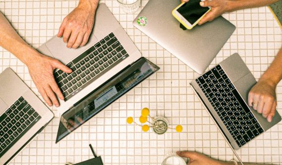 photo of people using laptop